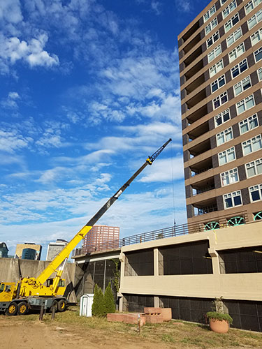 Crane working on tall building